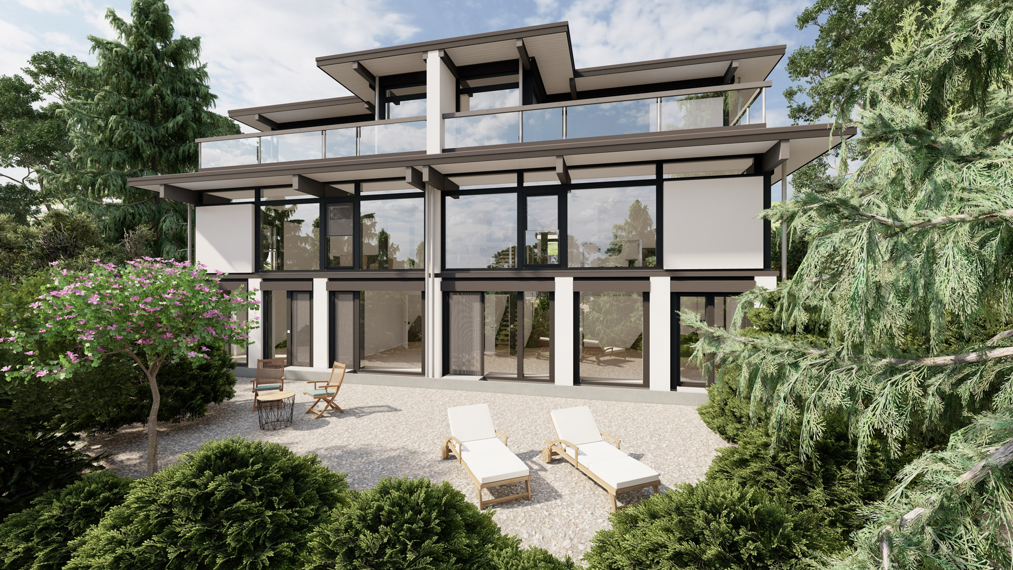 Ansicht eines Mehrfamilienhauses mit Garten und Terrasse