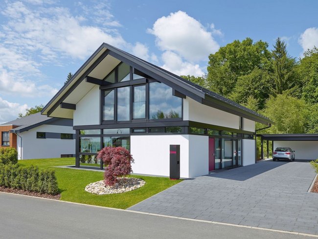 Stilvolles Architektenhaus in idyllischer Landschaft Gemütliches Familienhaus mit modernem Design und großem Fensteranteil
