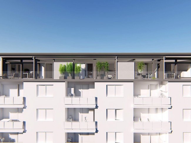 Aufstockung eines Wohnhauses mit modernen Balkonen Moderne Architektur mit Aufstockung und Terrassen auf einem Wohngebäude